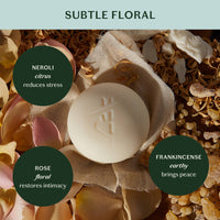Soap bar with floral and natural elements on a light green background