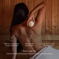 Woman holding a hot pack with text describing its use in a wooden room setting.