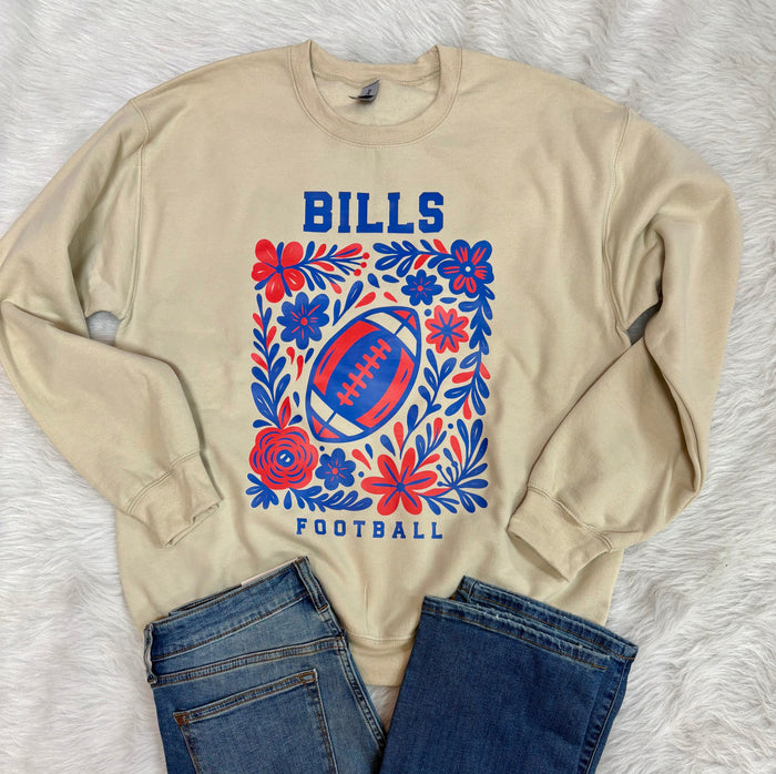Woman wearing a colorful floral blouse with a blurred natural background