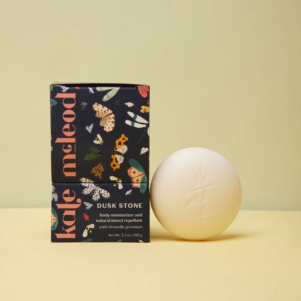 Kate McLeod Dusk Stone packaging with a white stone on a beige background
