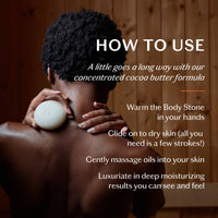 Person using a body stone with text on how to use a concentrated cocoa butter formula.