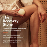 Person applying a white stone to their leg with text about 'The Recovery Stone' product.