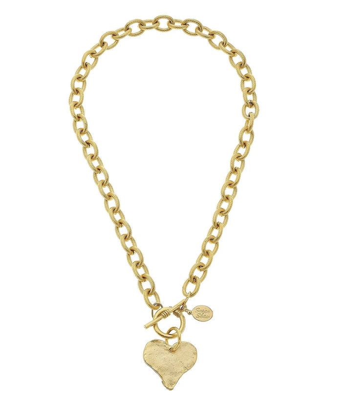 Gold chain necklace with a heart-shaped pendant on a white background