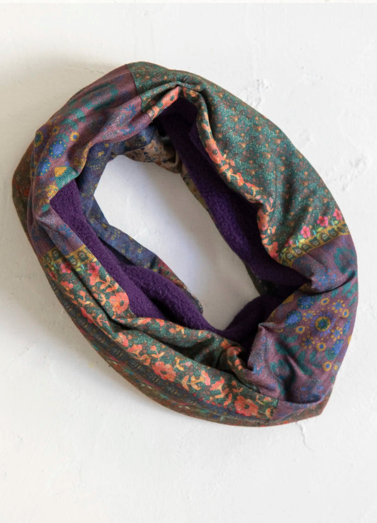 Multicolored patterned infinity scarf on a white background